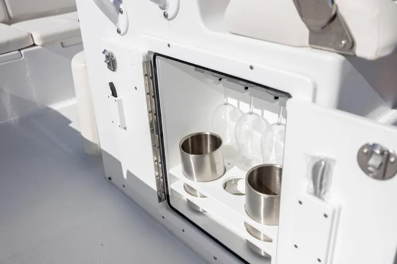  Yacht Photos Pics 2024 Sea Hunt Escape 28 boat interior with built-in cup and glass holders.