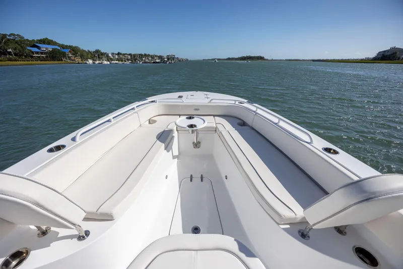  Yacht Photos Pics 2024 Sea Hunt Escape 28 boat with spacious seating on calm water.