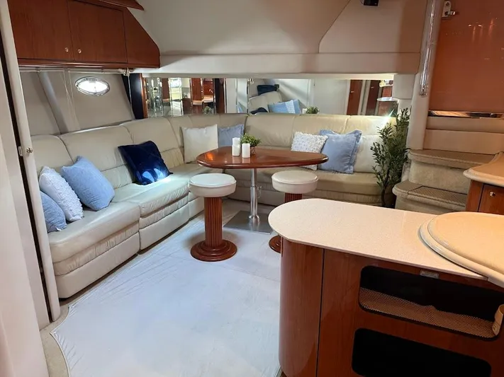  Yacht Photos Pics Luxurious interior of 2000 Sea Ray 510 Sundancer yacht with plush seating and elegant decor.