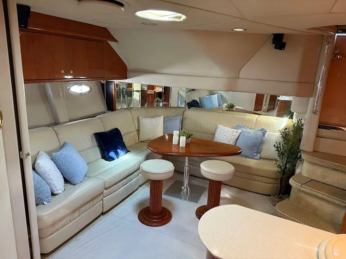  Yacht Photos Pics Luxurious interior of 2000 Sea Ray 510 Sundancer yacht with plush seating and elegant decor.