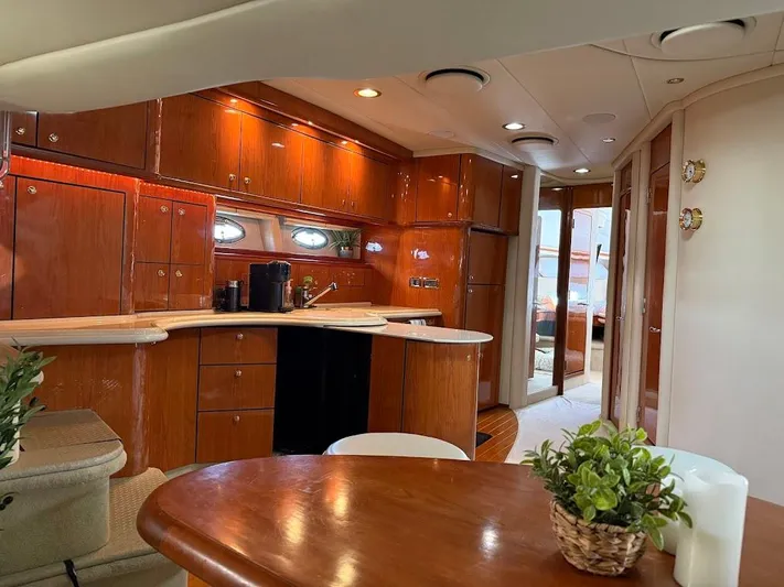  Yacht Photos Pics Interior of 2000 Sea Ray 510 Sundancer yacht with elegant wood cabinetry and modern amenities.
