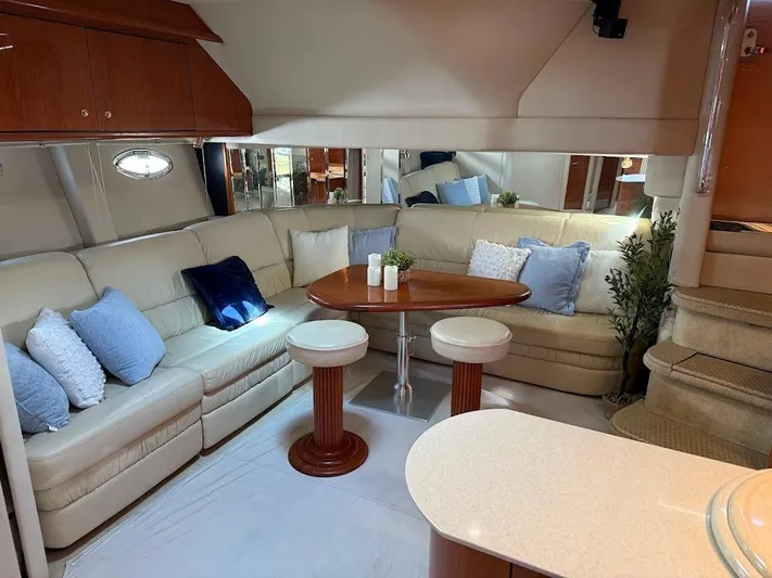  Yacht Photos Pics Luxurious interior of 2000 Sea Ray 510 Sundancer yacht with plush seating and elegant decor.