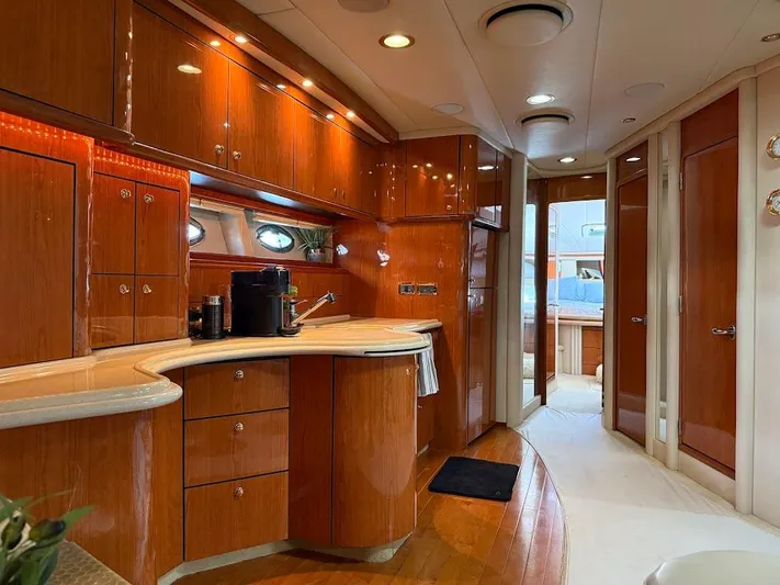  Yacht Photos Pics Luxurious interior of a 2000 Sea Ray 510 Sundancer yacht with polished wood cabinetry.