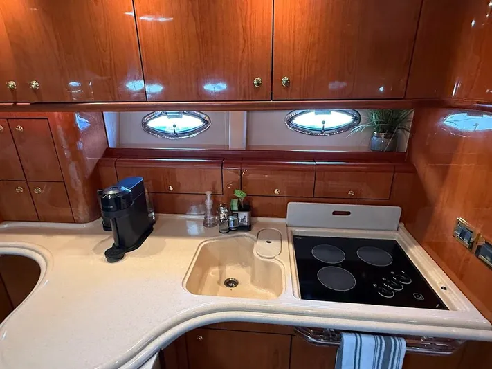  Yacht Photos Pics Luxurious kitchen interior of 2000 Sea Ray 510 Sundancer yacht with modern amenities.