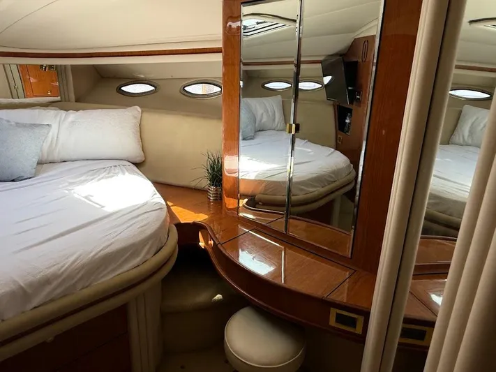  Yacht Photos Pics Luxurious cabin interior of 2000 Sea Ray 510 Sundancer yacht with elegant wood finish.