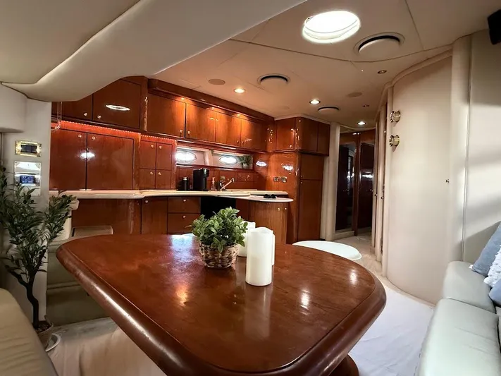  Yacht Photos Pics Luxurious interior of 2000 Sea Ray 510 Sundancer yacht with elegant wood finishes.