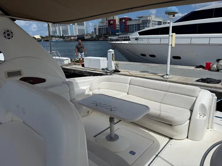  Yacht Photos Pics Luxurious 2000 Sea Ray 510 Sundancer yacht interior with white seating and table, docked at marina.