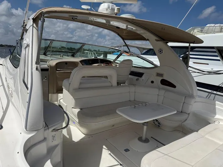  Yacht Photos Pics 2000 Sea Ray 510 Sundancer yacht interior with seating and table under canopy.