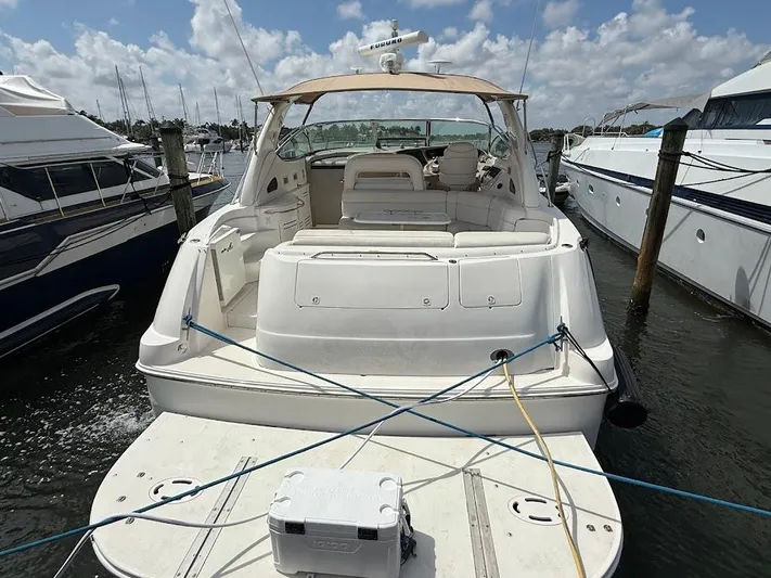  Yacht Photos Pics 2000 Sea Ray 510 Sundancer yacht docked at marina under blue sky.