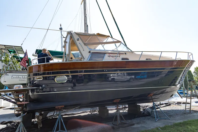 A'maure Yacht Photos Pics 2001 Apreamare 11 yacht on dry dock, showcasing elegant design and craftsmanship.