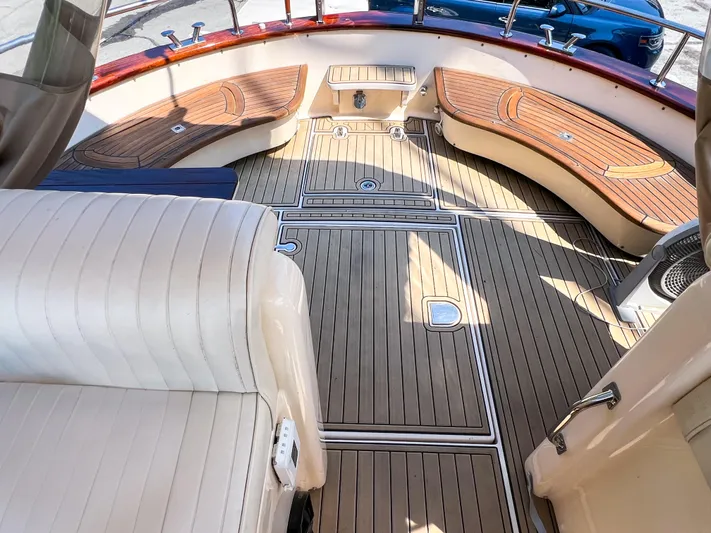 A'maure Yacht Photos Pics Luxurious 2001 Apreamare 11 yacht deck with elegant wood finish and comfortable seating.