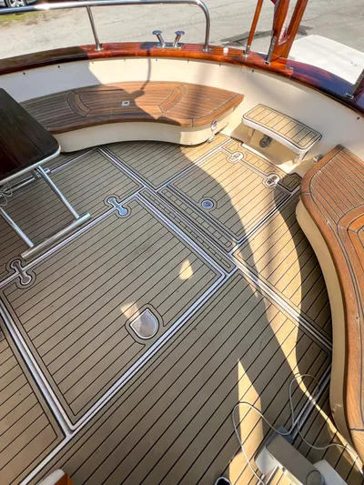 A'maure Yacht Photos Pics Teak deck of 2001 Apreamare 11 boat with elegant wood finish and seating.