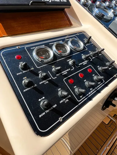 A'maure Yacht Photos Pics Control panel of a 2001 Apreamare 11 boat with various switches and gauges.