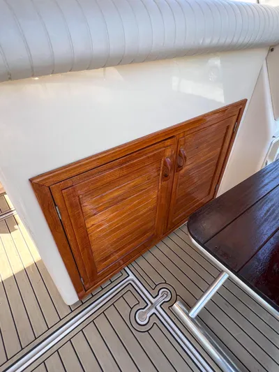 A'maure Yacht Photos Pics Wooden cabinet on Apreamare 11 boat, 2001 model, with sleek interior design.