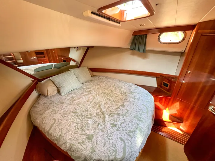 A'maure Yacht Photos Pics Luxurious cabin interior of 2001 Apreamare 11 yacht with elegant wood finish.