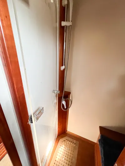 A'maure Yacht Photos Pics Shower area inside a 2001 Apreamare 11 boat, featuring wooden accents and modern fixtures.