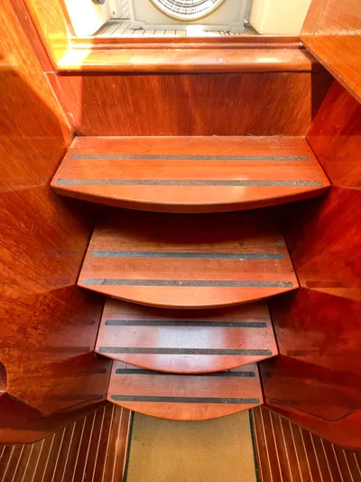 A'maure Yacht Photos Pics Wooden interior stairs of a 2001 Apreamare 11 yacht, featuring anti-slip strips.