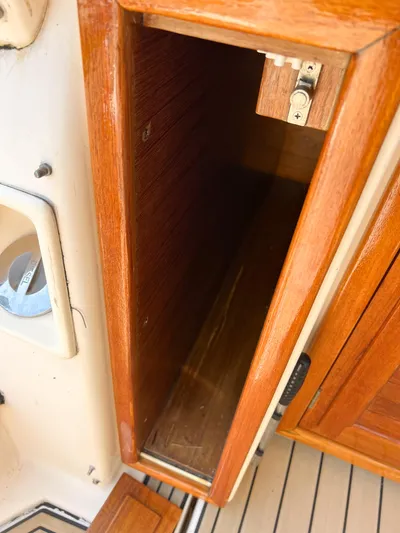 A'maure Yacht Photos Pics Open wooden storage compartment on 2001 Apreamare 11 boat.
