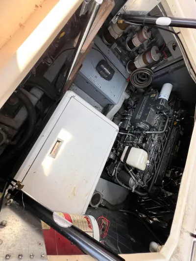 A'maure Yacht Photos Pics Engine room of a 2001 Apreamare 11 boat, featuring mechanical components and storage.