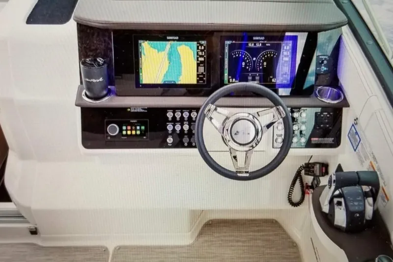  Yacht Photos Pics 2019 Sea Ray Sundancer 320 helm with navigation screens and controls.