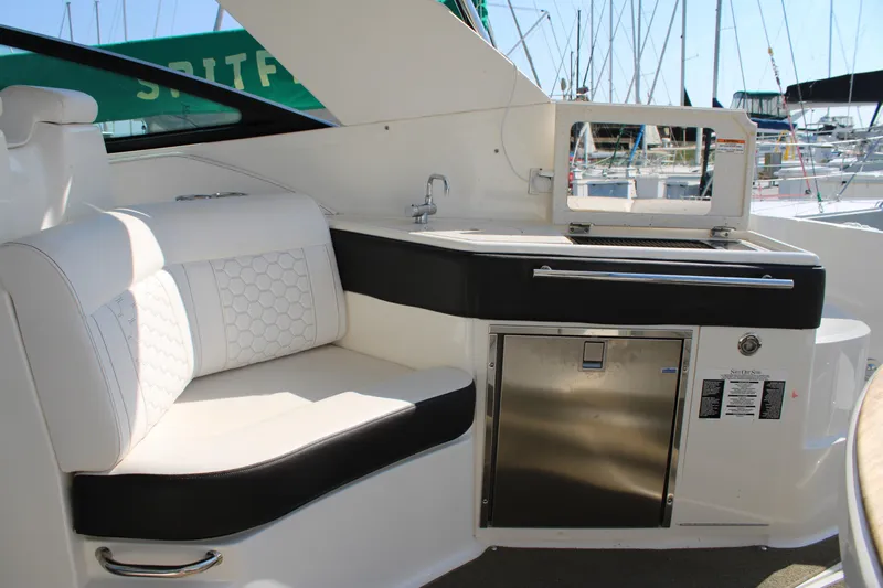  Yacht Photos Pics Luxurious interior of 2019 Sea Ray Sundancer 320 yacht with seating and kitchenette.