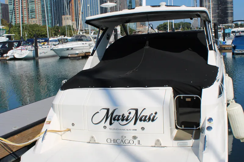  Yacht Photos Pics 2019 Sea Ray Sundancer 320 docked in Chicago marina with city skyline.