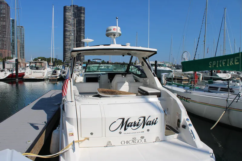  Yacht Photos Pics 2019 Sea Ray Sundancer 320 docked in Chicago marina with city skyline.