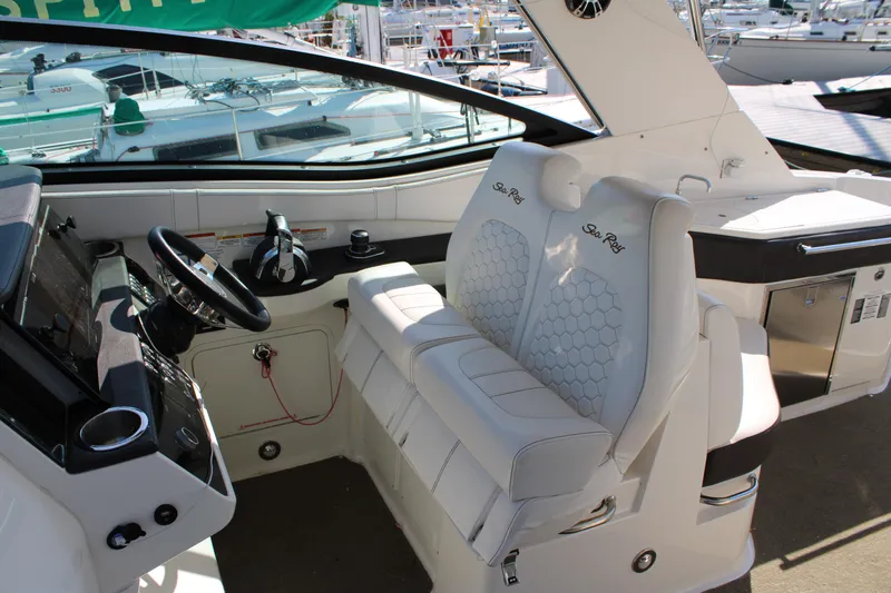  Yacht Photos Pics 2019 Sea Ray Sundancer 320 cockpit with dual seats and modern controls.
