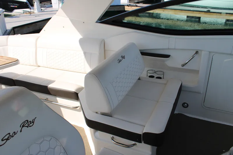  Yacht Photos Pics 2019 Sea Ray Sundancer 320 interior with white seating and elegant design.