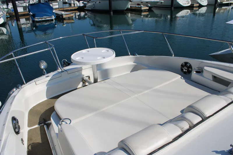  Yacht Photos Pics 2019 Sea Ray Sundancer 320 boat with spacious deck and seating area in marina.