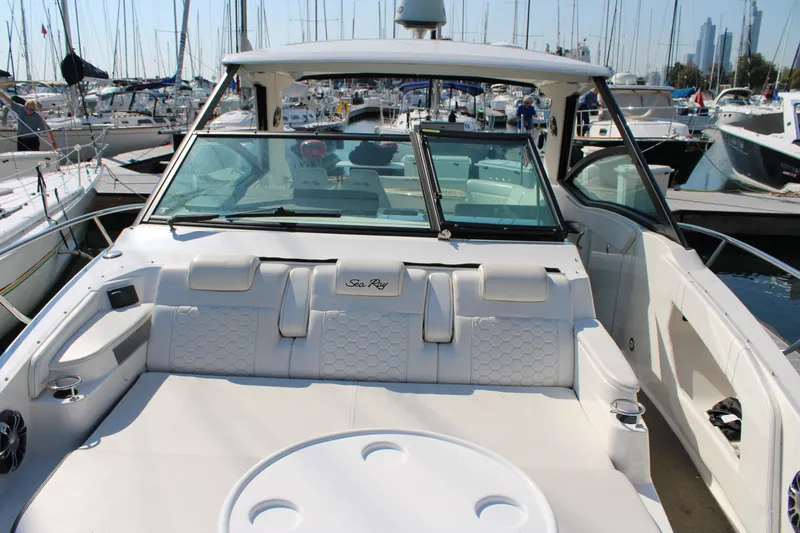  Yacht Photos Pics 2019 Sea Ray Sundancer 320 boat interior at marina, featuring luxurious seating and modern design.