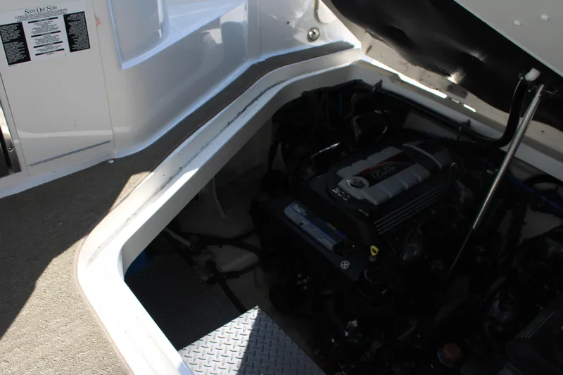  Yacht Photos Pics Engine compartment of a 2019 Sea Ray Sundancer 320 boat, showcasing the engine details.