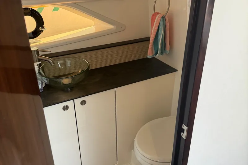  Yacht Photos Pics 2019 Sea Ray Sundancer 320 bathroom with modern sink and compact design.