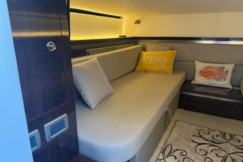  Yacht Photos Pics 2019 Sea Ray Sundancer 320 interior with cozy seating and decorative pillows.