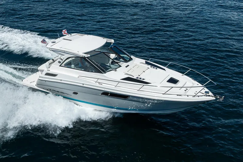 Damn Daddy Yacht Photos Pics 2020 Regal 35 Sport Coupe cruising on open water, showcasing sleek design and performance.