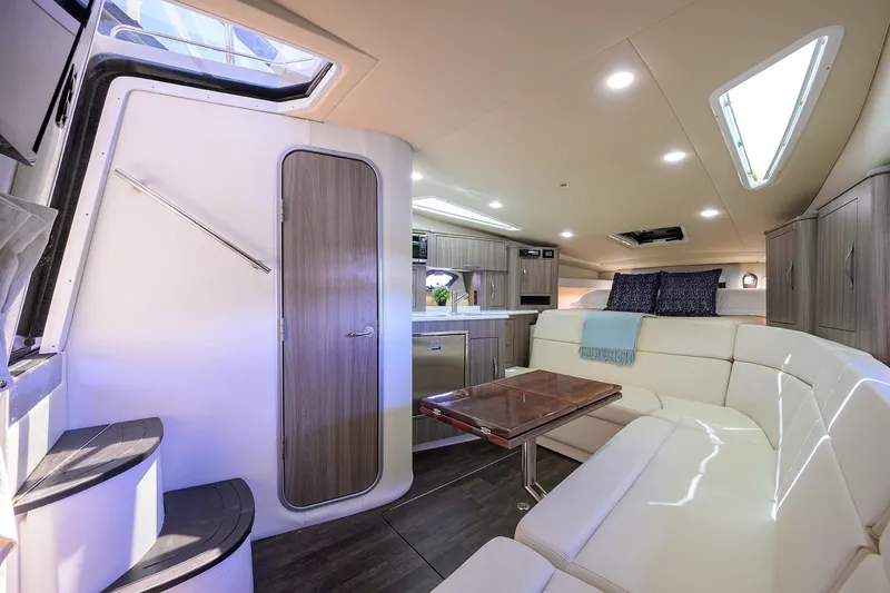 Damn Daddy Yacht Photos Pics Luxurious interior of 2020 Regal 35 Sport Coupe with modern seating and elegant design.