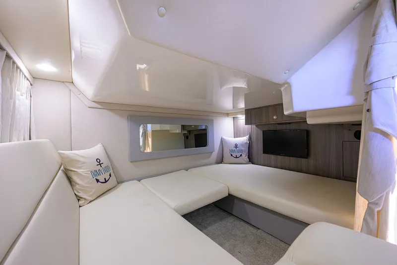 Damn Daddy Yacht Photos Pics Luxurious interior of 2020 Regal 35 Sport Coupe with cozy seating and modern decor.
