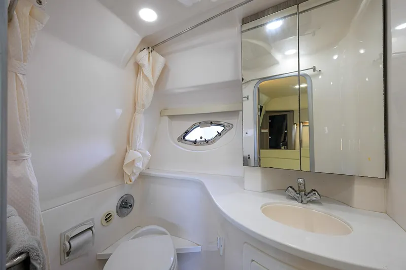 Damn Daddy Yacht Photos Pics 2020 Regal 35 Sport Coupe bathroom with modern fixtures and mirrored cabinet.