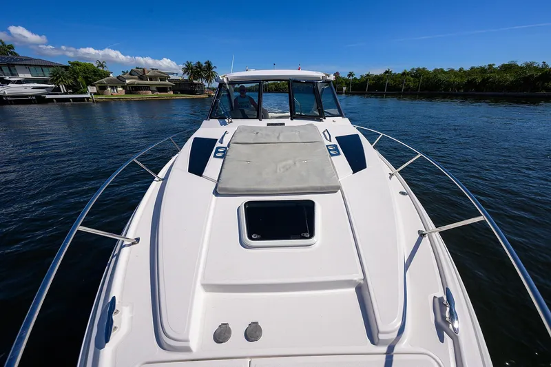 Damn Daddy Yacht Photos Pics 2020 Regal 35 Sport Coupe cruising on a sunny day, showcasing sleek design and luxury.