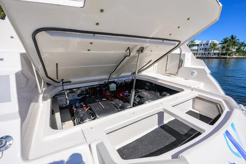 Damn Daddy Yacht Photos Pics 2020 Regal 35 Sport Coupe engine compartment open, showcasing dual engines by the water.