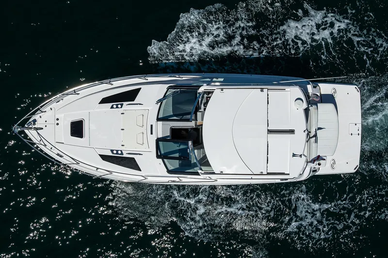Damn Daddy Yacht Photos Pics Overhead view of 2020 Regal 35 Sport Coupe cruising on water.