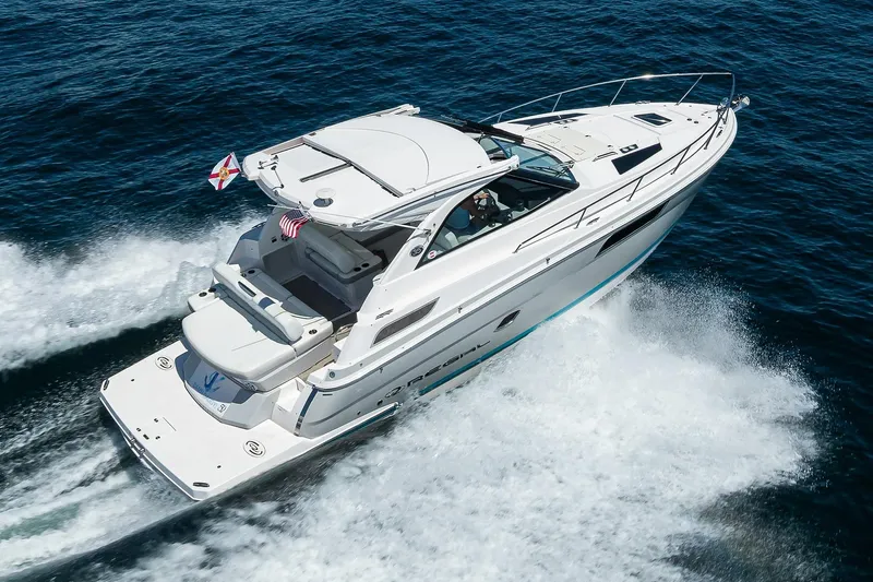 Damn Daddy Yacht Photos Pics 2020 Regal 35 Sport Coupe cruising on open water, showcasing sleek design and performance.