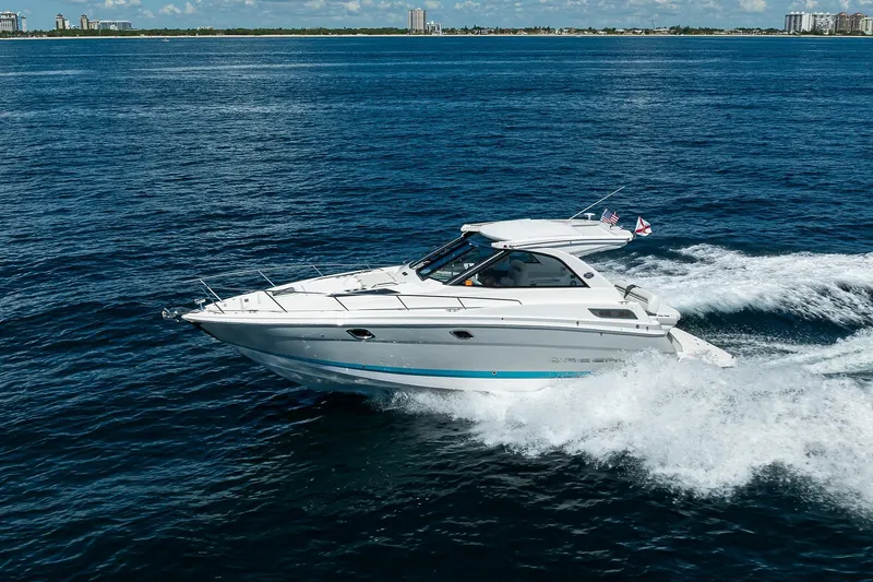 Damn Daddy Yacht Photos Pics 2020 Regal 35 Sport Coupe cruising on open blue water.