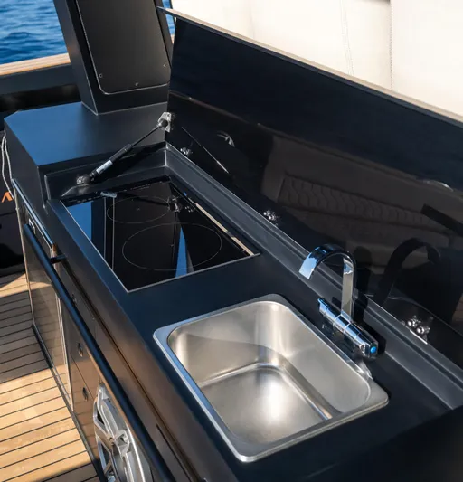 Stock Yacht Photos Pics Outdoor kitchen on 2025 Maxim Yachts 43 Comfort, featuring a sleek sink and stove.