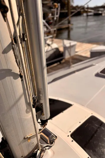 Orion Yacht Photos Pics Close-up of a 2002 Hunter 410 sailboat mast and deck at a marina.