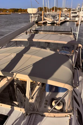 Orion Yacht Photos Pics Sailboat docked at marina, Hunter 410 model, 2002, with clear skies and calm waters.