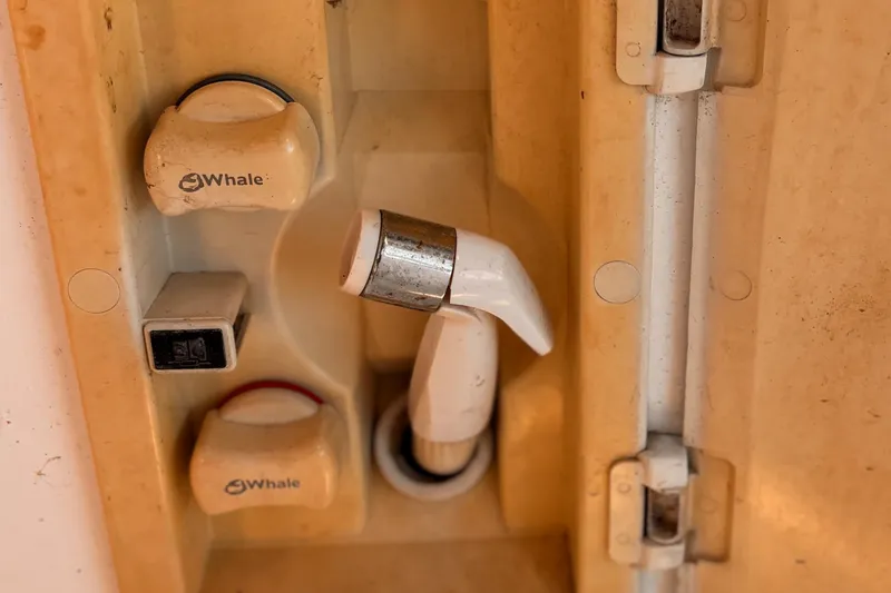 Orion Yacht Photos Pics Boat shower control panel with Whale brand knobs, Hunter 410 model, 2002.