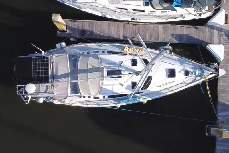 Orion Yacht Photos Pics Aerial view of a 2002 Hunter 410 sailboat docked at a marina.