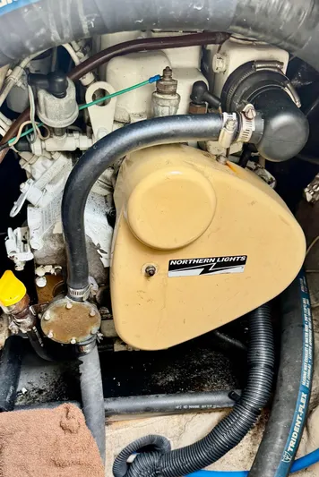 Orion Yacht Photos Pics Engine compartment of a 2002 Hunter 410 sailboat with Northern Lights generator.