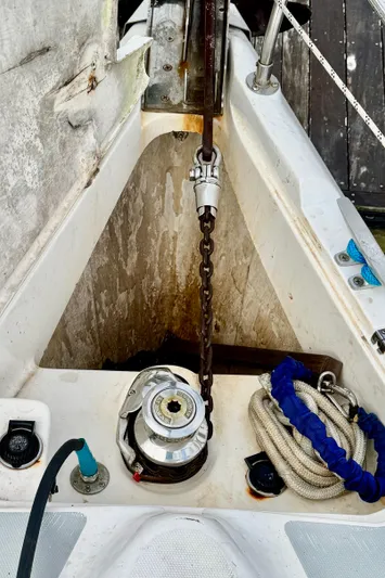 Orion Yacht Photos Pics Anchor chain and winch on a 2002 Hunter 410 sailboat deck.
